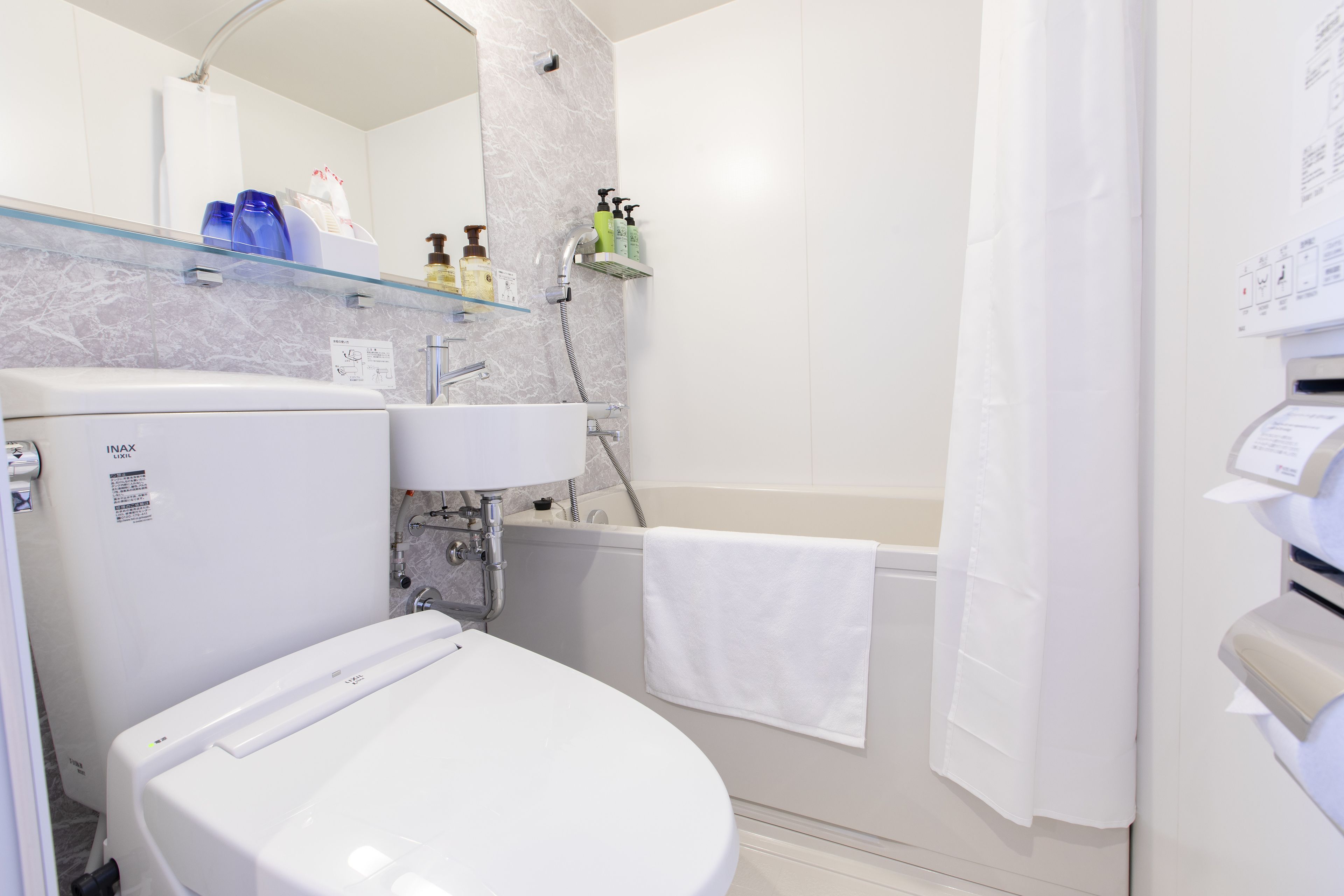 combined shower/bathtub, free toiletries, hair dryer, slippers