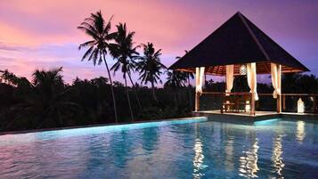 Outdoor pool, open 7:00 AM to 8:00 PM, pool loungers