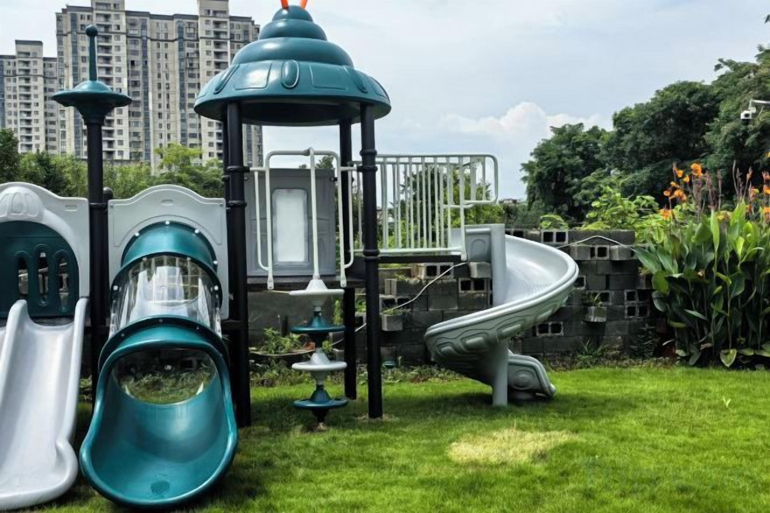 A playground with slides and climbing structures.