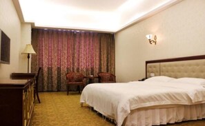 Standard Double or Twin Room | Minibar, in-room safe, desk, blackout drapes