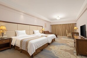 A hotel room with two beds, a TV, a desk, and a chair. - Lianjiang Libo Hotel (Lianjiang)