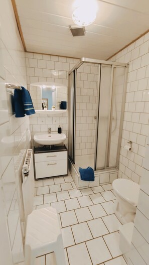 Shower, hair dryer, towels, soap