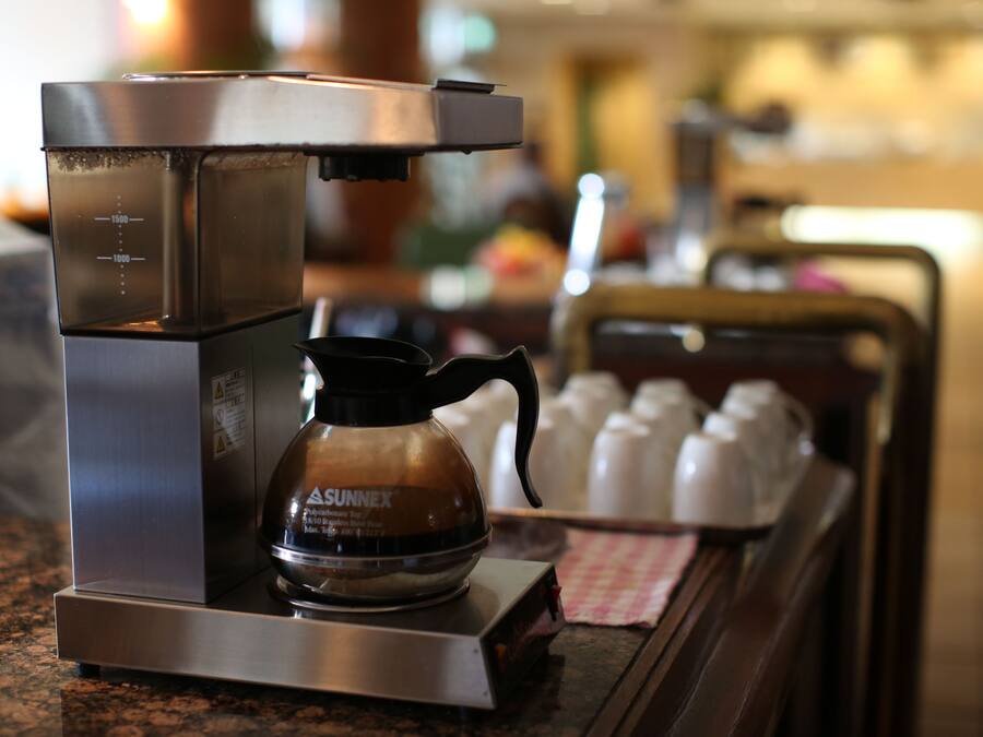 A coffee machine with a portafilter on a countertop.