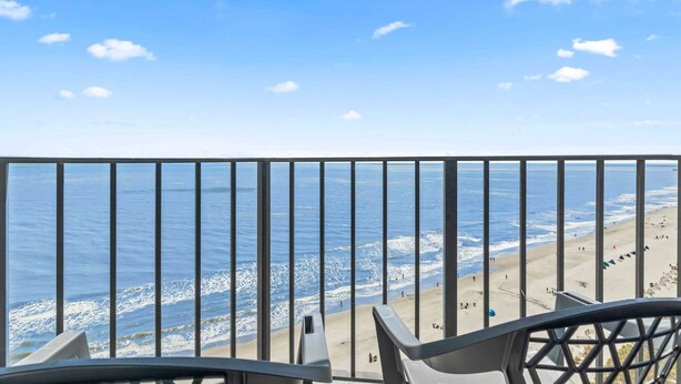 A balcony with a view of the beach and ocean. - Palace 1503 (Myrtle Beach)