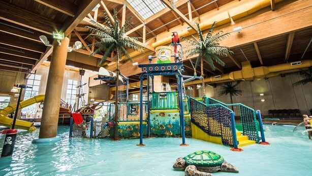 An indoor water park with slides, a play area, and a large pool. - Bridges Bay Ranch style, single story home with 3 bedrooms and 2 bathrooms (Arnolds Park)