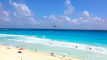On the beach, sun loungers, beach towels