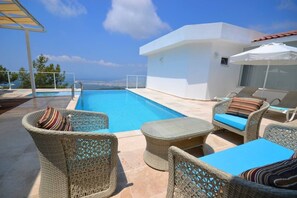 Outdoor pool, pool umbrellas, pool loungers