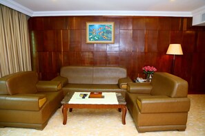 Deluxe Suite, City View | Living room | 42-inch TV with cable channels - Asia Palace Hotel (Phnom Penh)