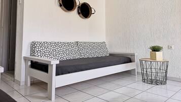 Apartment, 1 Bedroom | Living area | Flat-screen TV