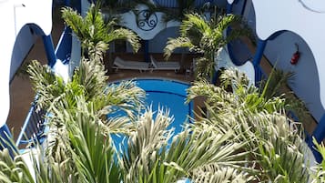 Outdoor pool, open 7:00 AM to 11:30 PM, pool loungers