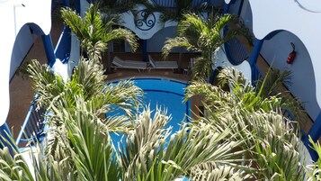 Outdoor pool, open 7:00 AM to 11:30 PM, sun loungers