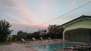 Seasonal outdoor pool, pool umbrellas, sun loungers