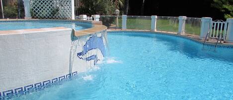 Outdoor pool, open 9:00 AM to 9:00 PM, pool umbrellas, pool loungers