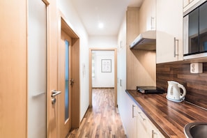 Fridge, microwave, stovetop, coffee/tea maker