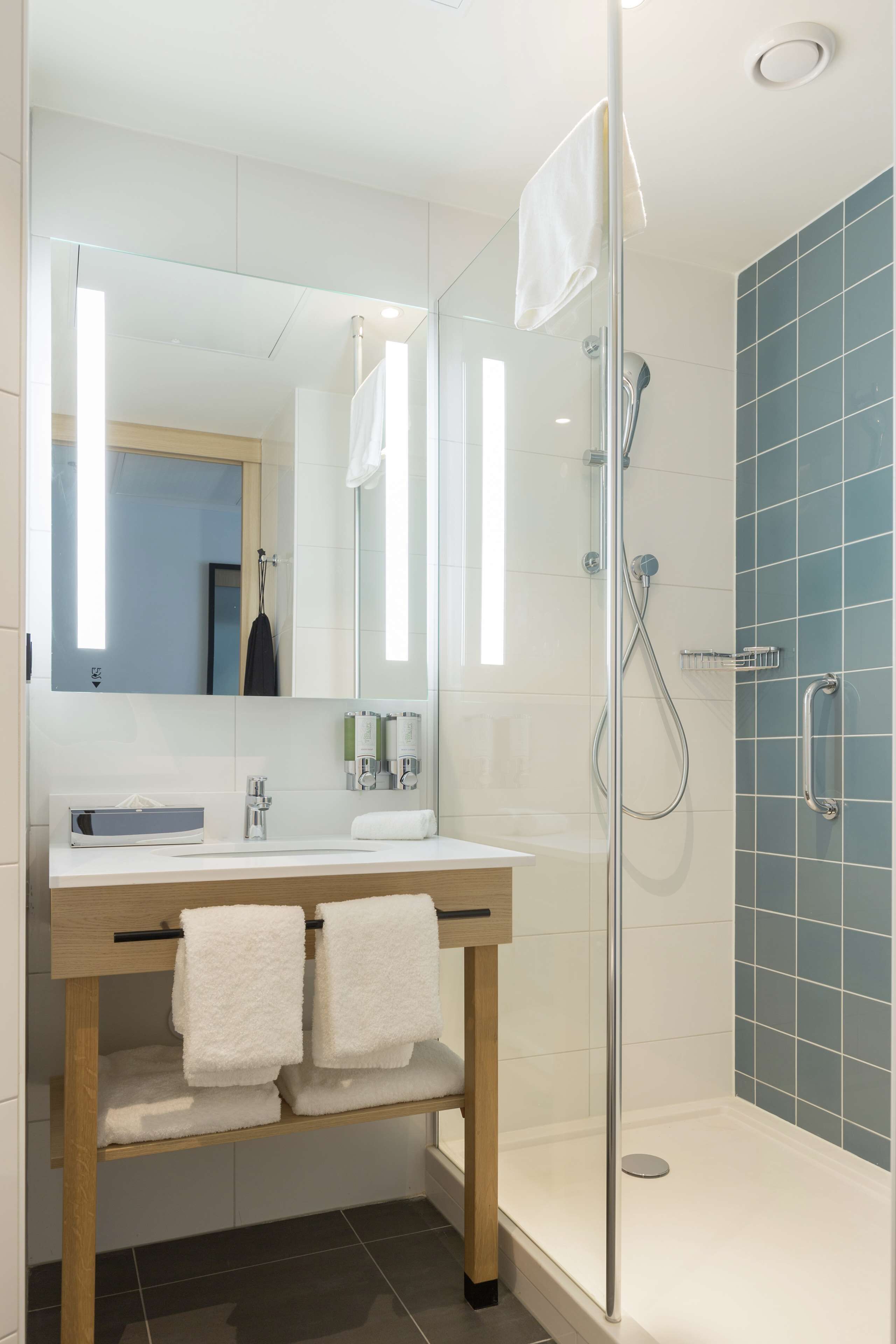 shower, eco-friendly toiletries, hair dryer, towels