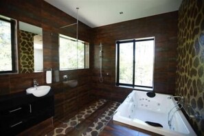 Separate bathtub and shower, hair dryer, towels