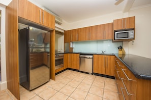 Comfort Apartment, 2 Bedrooms, Terrace, Garden View | Private kitchen - Picnic Bay Apartments Unit 1 (Picnic Bay)