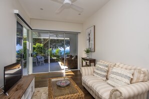 Superior Villa, 1 Bedroom, Pool Access, Ocean View | Living room | TV, DVD player - Reflections Villa 2 (Picnic Bay)