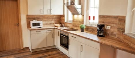 Apartment, Garden View (Froschkönig) | Private kitchen | Fridge, microwave, stovetop, dishwasher