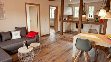 Apartment, Garden View (Froschkönig) | Living area | Flat-screen TV, toys