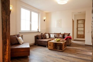 Apartment, 3 Bedrooms, Garden View (Rotkäppchen) | Living area | Flat-screen TV, toys - Landhaus im Rinnetal (Homberg)