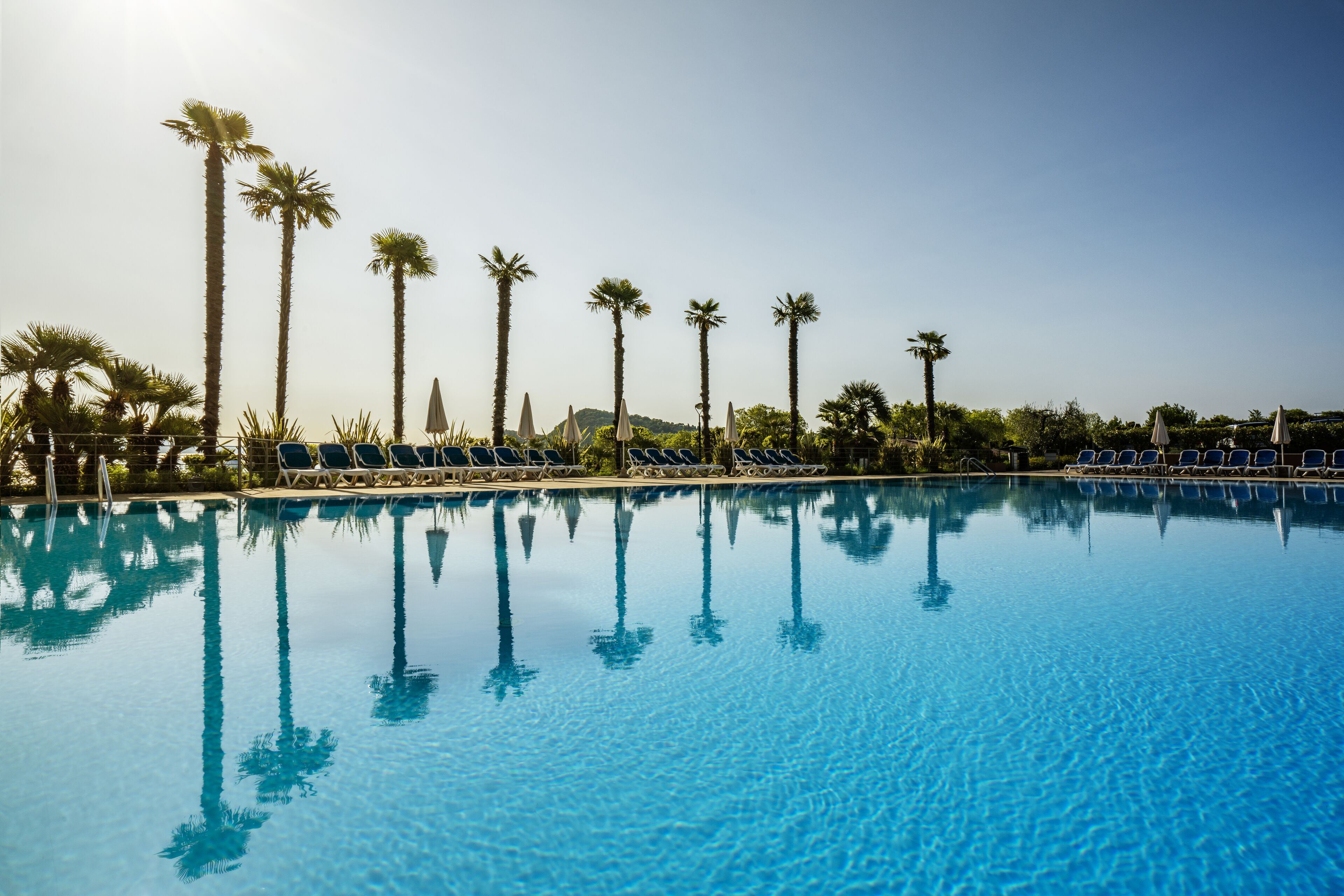 Outdoor pool, open 8:00 AM to 7:00 PM, pool umbrellas, sun loungers