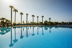 Outdoor pool, open 8:00 AM to 7:00 PM, pool umbrellas, sun loungers