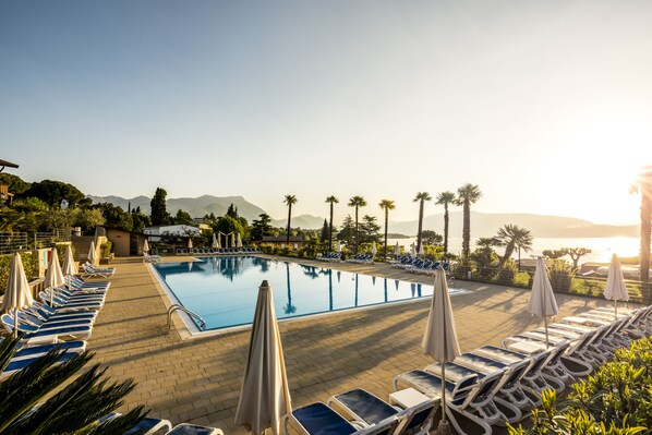 Outdoor pool, open 8:00 AM to 7:00 PM, pool umbrellas, pool loungers