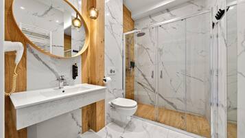 Romantic Studio Suite, Hot Tub | Bathroom | Shower, rainfall showerhead, free toiletries, hair dryer