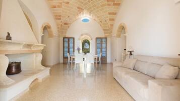 Classic Villa, 3 Bedrooms | Living area | Flat-screen TV, fireplace