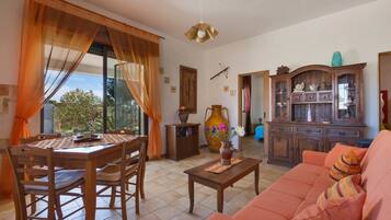 Standard House, 2 Bedrooms | Living room | Flat-screen TV