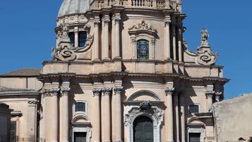 A historic building with a large dome and ornate architecture.