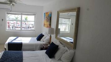 Deluxe Room, 2 Queen Beds, Kitchenette, Ocean View | Iron/ironing board, free WiFi, bed sheets