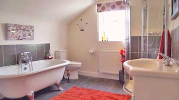 Combined shower/bathtub, deep-soaking bathtub, hair dryer, towels