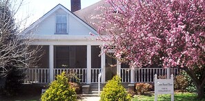 A two-story house with a porch, a sign for 'Home Sweet Home Bed & Breakfast' at 108 N. College St., Paris, TN 38242, and contact information. - Home Sweet Home Bed & Breakfast (Paris)