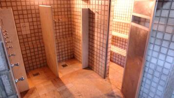 Bathroom features a bathtub and a shelf unit.
