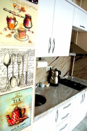 Apartment | Private kitchenette | Fridge, stovetop, electric kettle, cookware/dishes/utensils