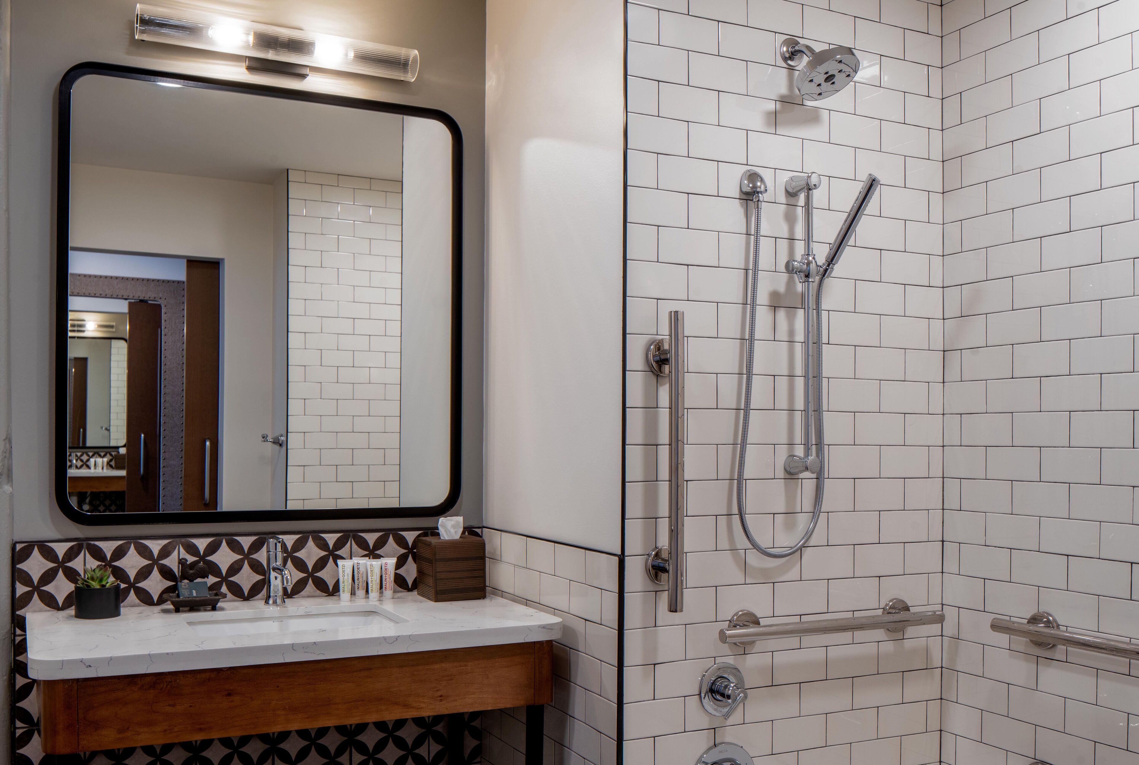 junior suite + ada with transfer shower | bathroom | shower, hydromassage showerhead, hair dryer, dressing gowns