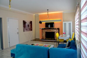 Apartment, Non Smoking | Living area | LCD TV, fireplace - Konukevim Mesrutiyet Large Studio 1 (Ankara)