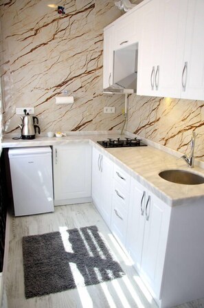 Apartment, Non Smoking | Private kitchen | Fridge, stovetop, electric kettle, cookware/dishes/utensils - Konukevim Mesrutiyet Large Studio 1 (Ankara)