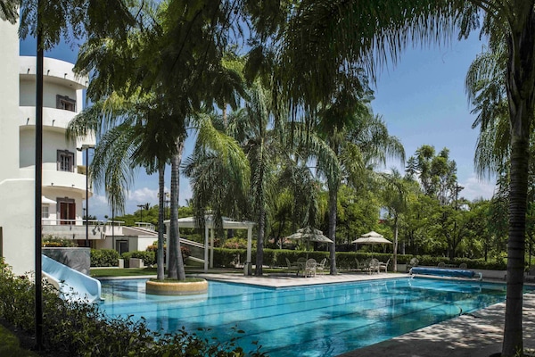 Outdoor pool, pool umbrellas, pool loungers