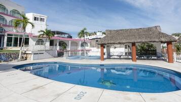 2 outdoor pools, open 8:00 AM to 10:00 PM, pool loungers