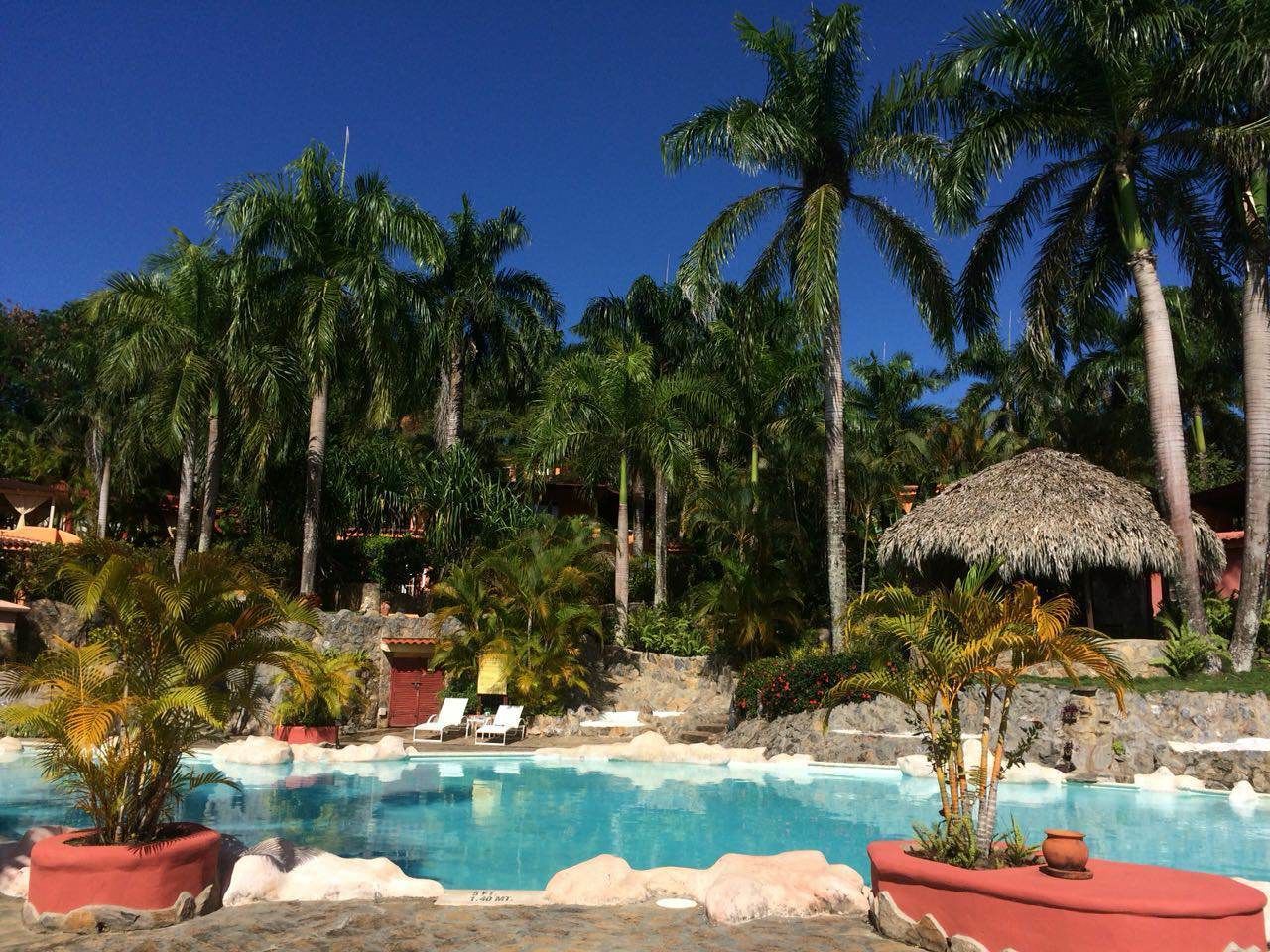 Outdoor pool, open 8:00 AM to 10:00 PM, pool umbrellas