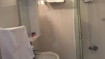 Shower, free toiletries, hair dryer, slippers