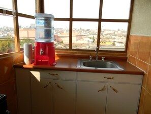 Apartment, 1 Double Bed, Non Smoking, City View | Private kitchen | Full-size fridge, microwave, oven, stovetop - Casa Xelaju (Quetzaltenango)