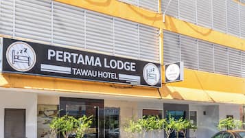 Welcome to Pertama Lodge, where a modern entrance sets the tone for a comfortable stay.