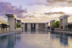Relax by the serene pool surrounded by sleek architecture.