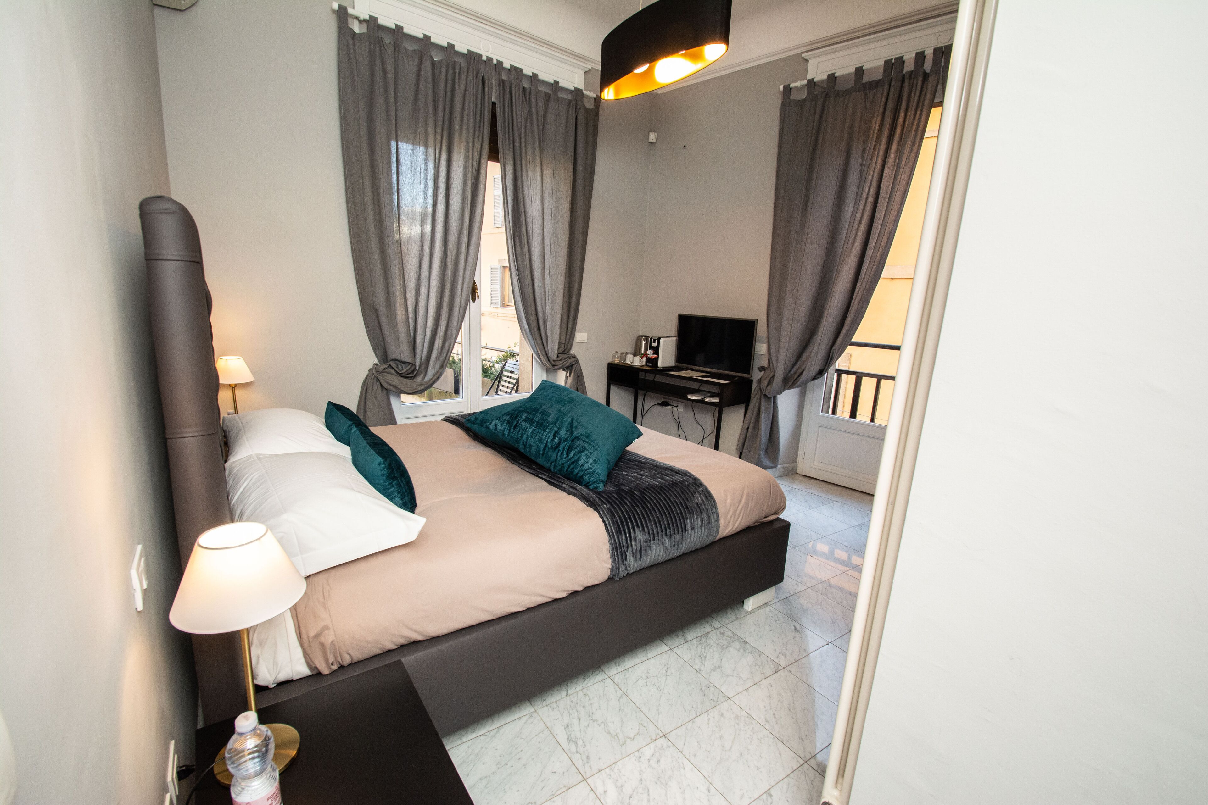 Deluxe Double Room | Desk, blackout curtains, iron/ironing board, cots/infant beds