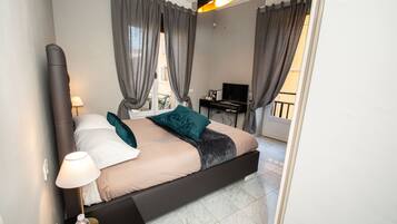 Deluxe Double Room | Desk, blackout curtains, iron/ironing board, cots/infant beds