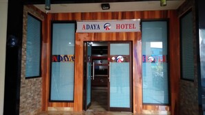 The entrance of Adaya Hotel with glass doors and a sign above. - Adaya Hotel (Bekasi)